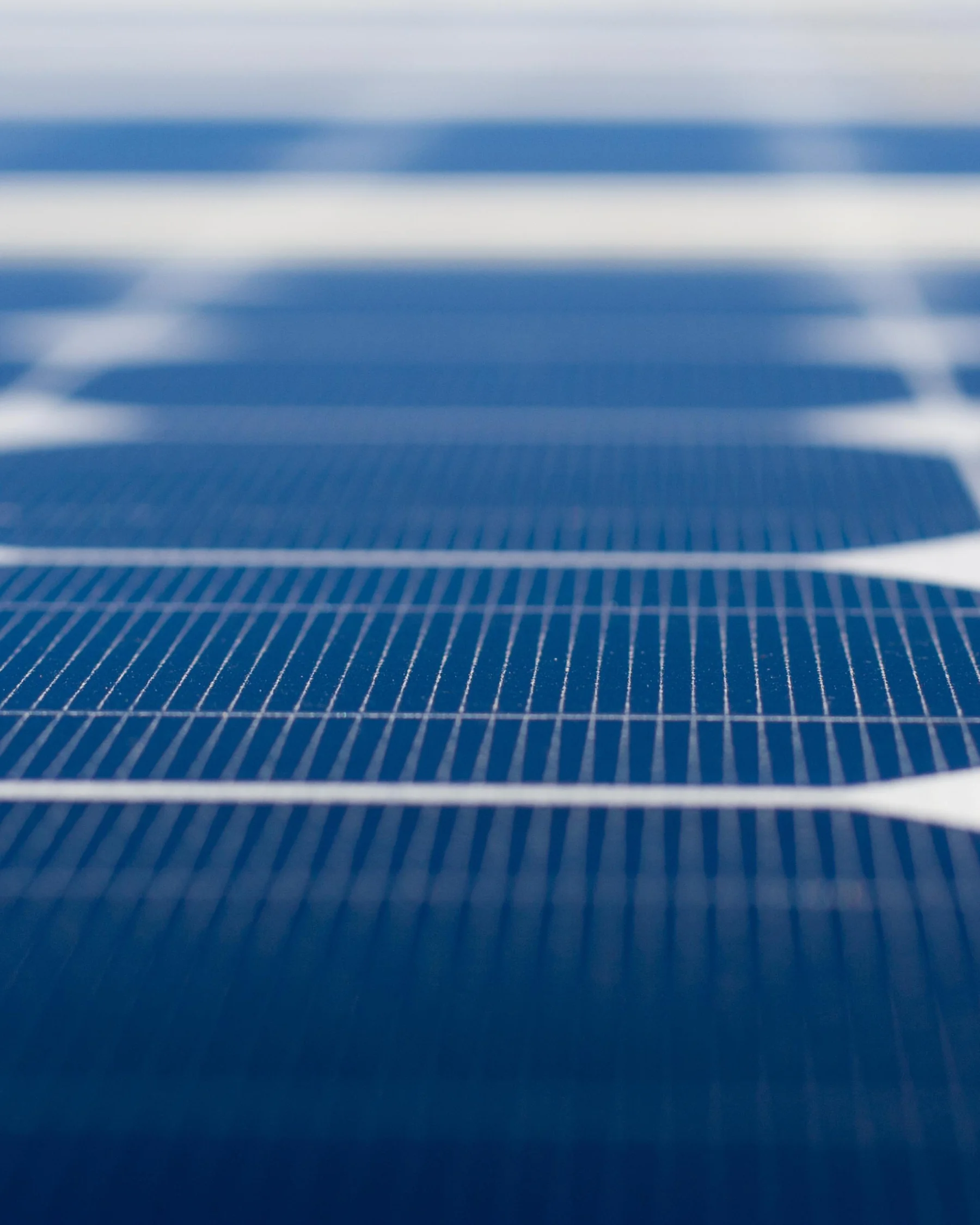 A close view of solar panel cells and framing